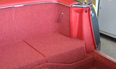 Fitted red carpet in a classic vehicle