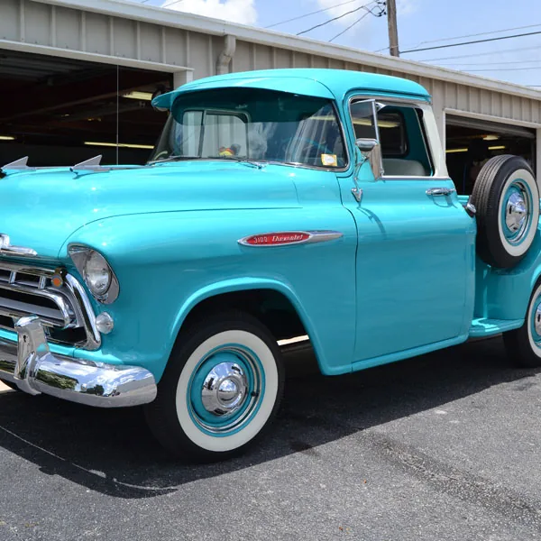 Turquoise classic Chevrolet pickup outside our upholstery shop